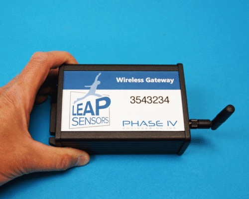 hand holding wireless sensor gateway from leap sensors